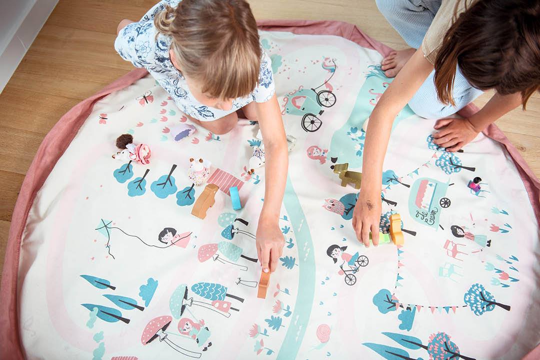 Walk in a Park toy storage bag and play mat, kids playing with wooden animal toys