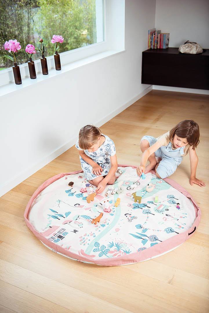 Walk in a Park toy storage bag and play mat, kids playing with wooden animal toys