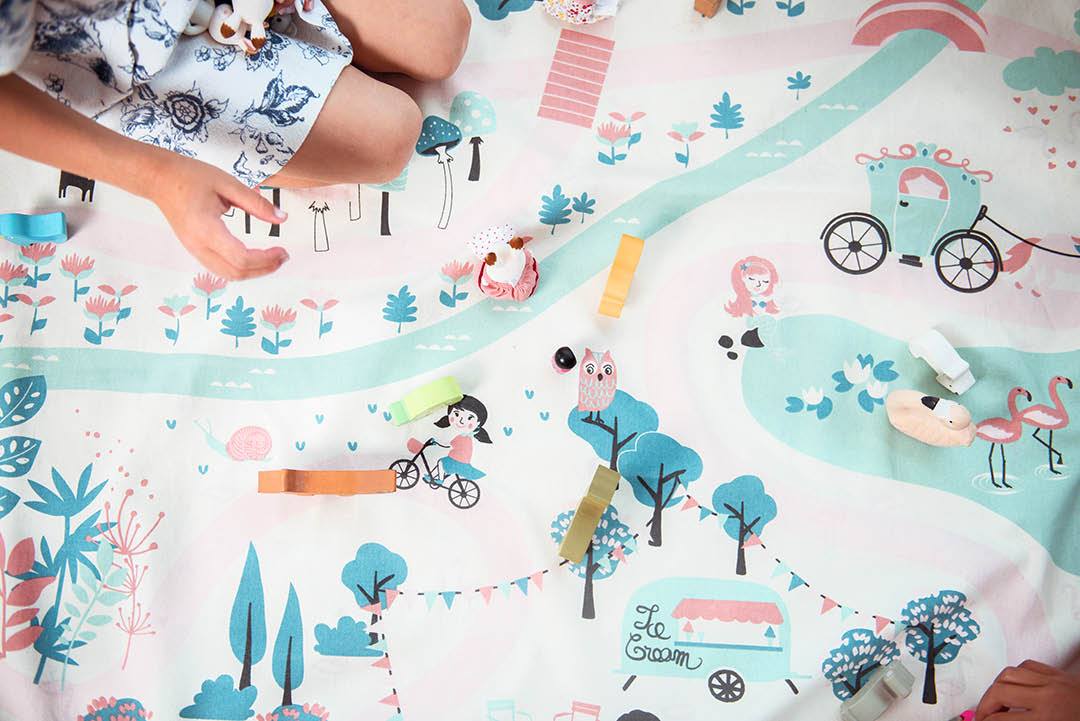 Walk in a Park toy storage bag and play mat, kids playing with wooden animal toys