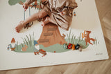 EEVAA Treehouse puzzlemat, child is playing on the mat, gnomes and rabbits, a fox playing the music