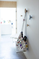 Play&Go storage bag and play mat, Omy Paris, self colored, hanging up on coat rack