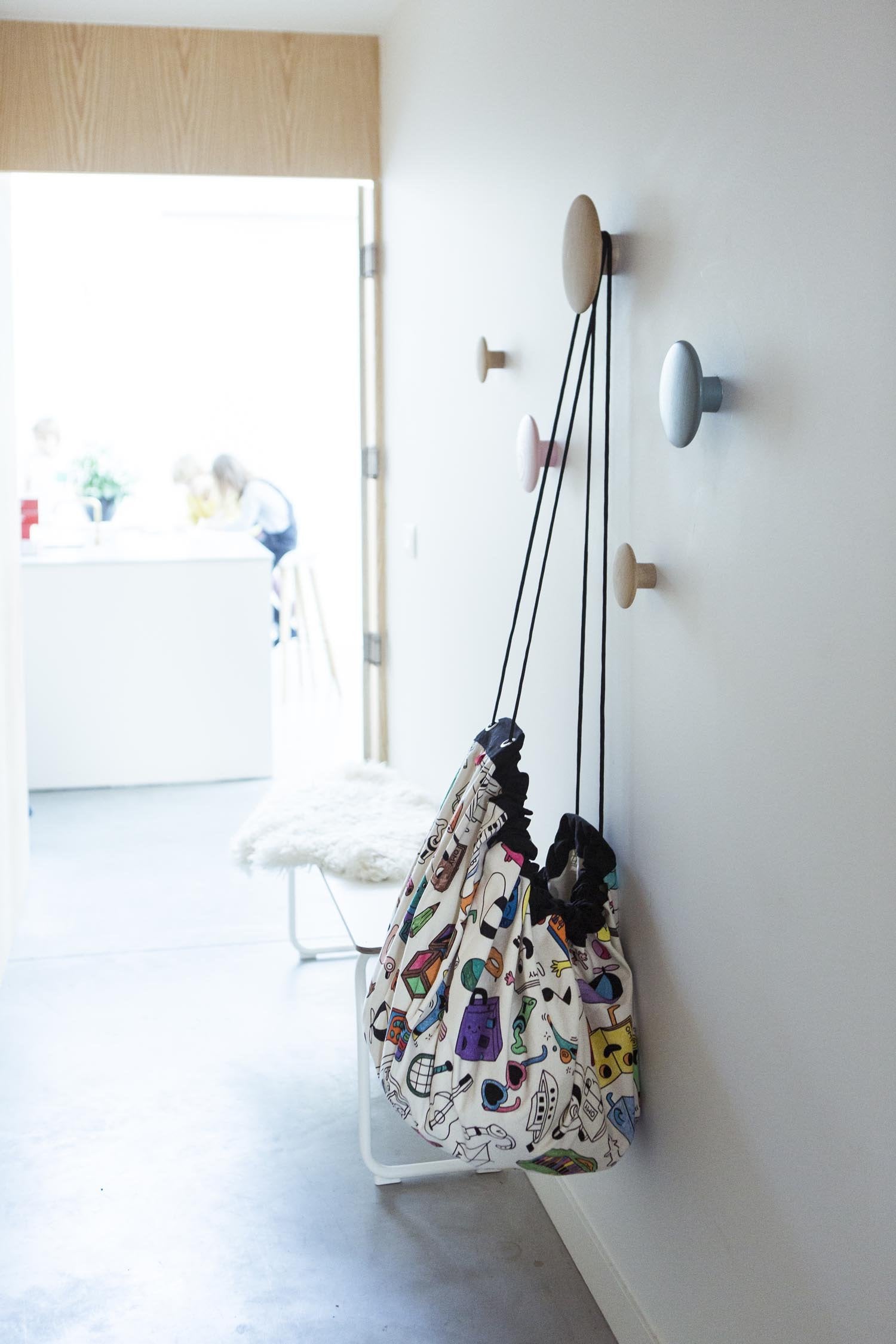 Play&Go storage bag and play mat, Omy Paris, self colored, hanging up on coat rack