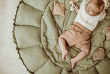 Bloom meadow green organic babymat, baby lying on open mat between toys