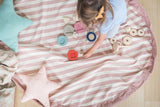 Stripes Pink New toy storage bag, child playing with wooden toys, mat open on floor