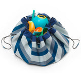 outdoor storage bag and play mat, blue/green stripes, closed bag, filled with beach toys