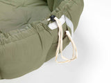 green baby mat, crib, detail of closure